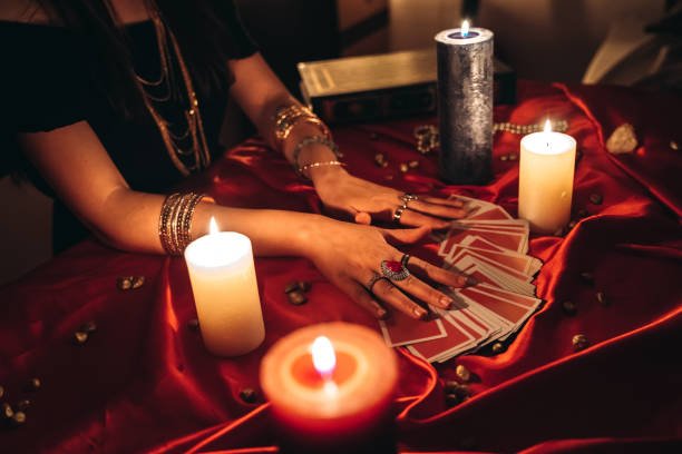 young female fortune teller reading tarot.